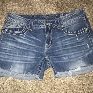 Miss Me cutoff blue jean shorts.